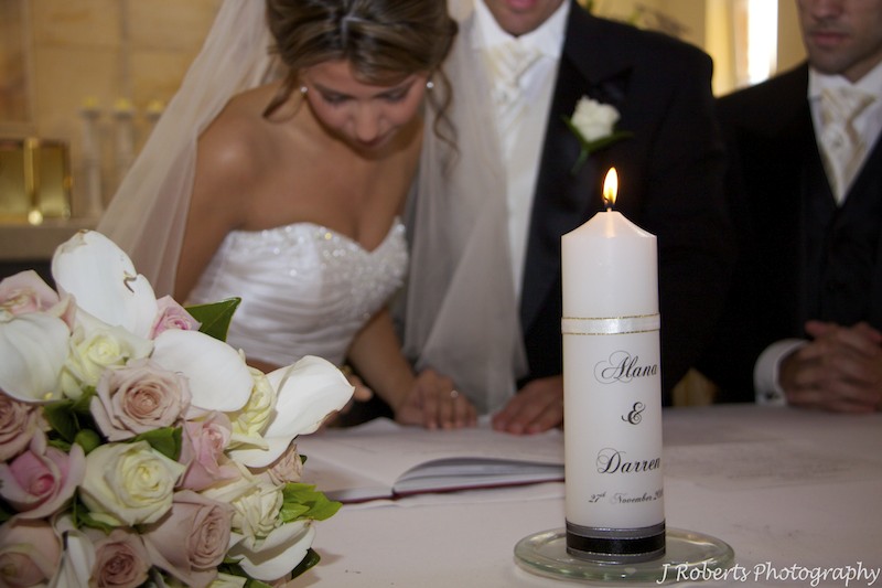 Signing the register - wedding photography